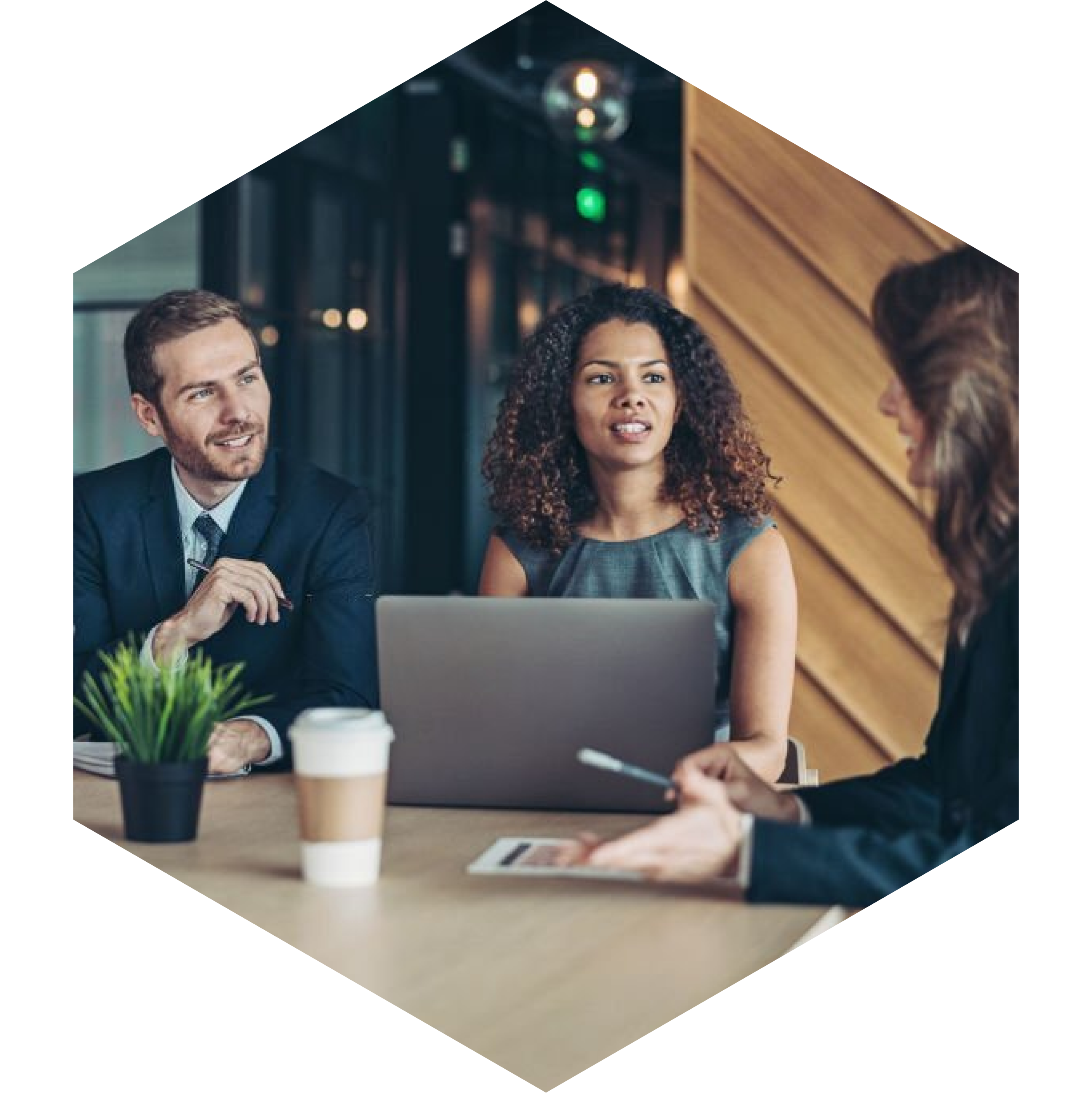 Three business professionals seated at a table | Jacko Law Group, PC