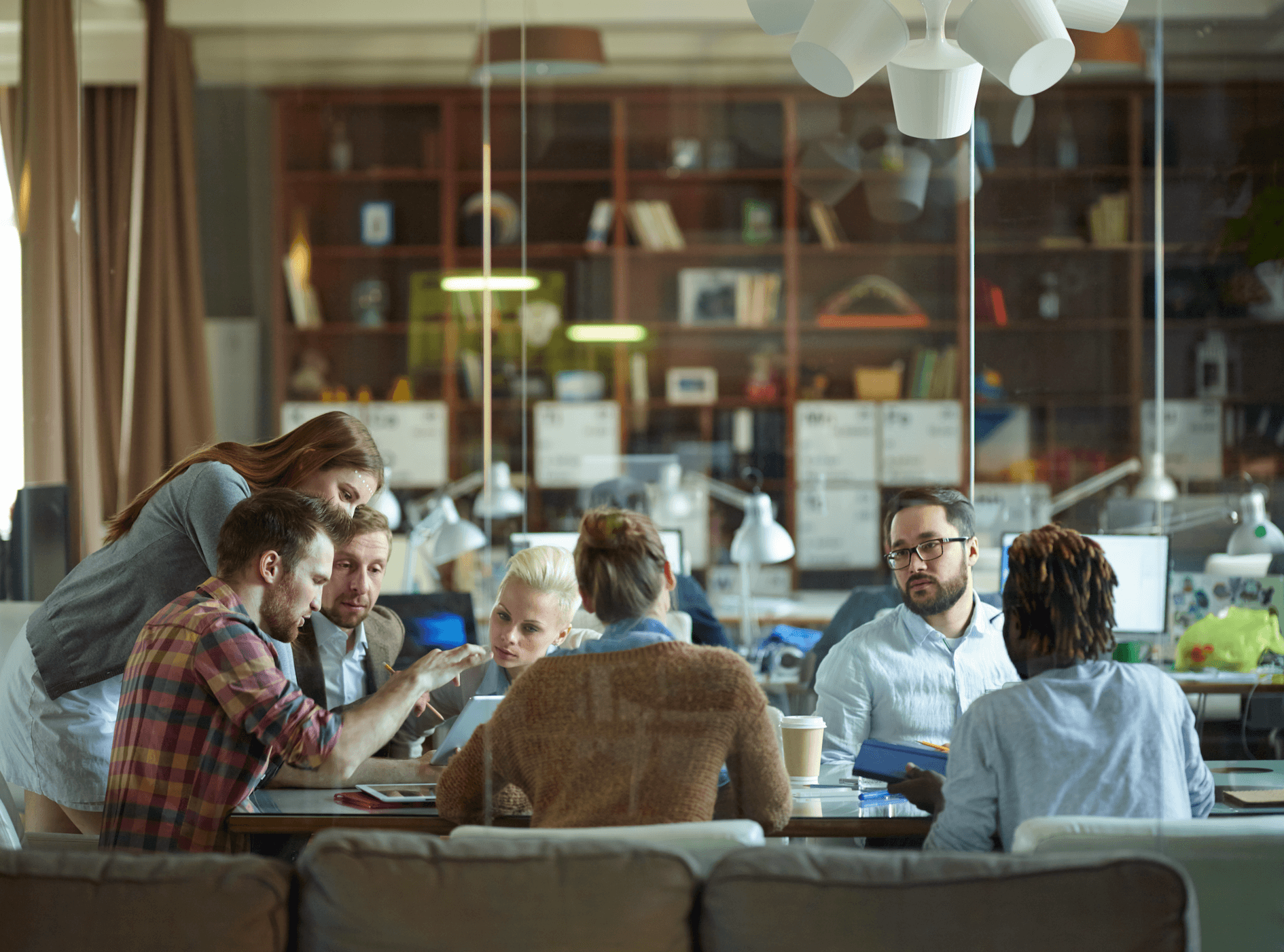A diverse group of individuals collaborates around a table | Jacko Law Group, PC