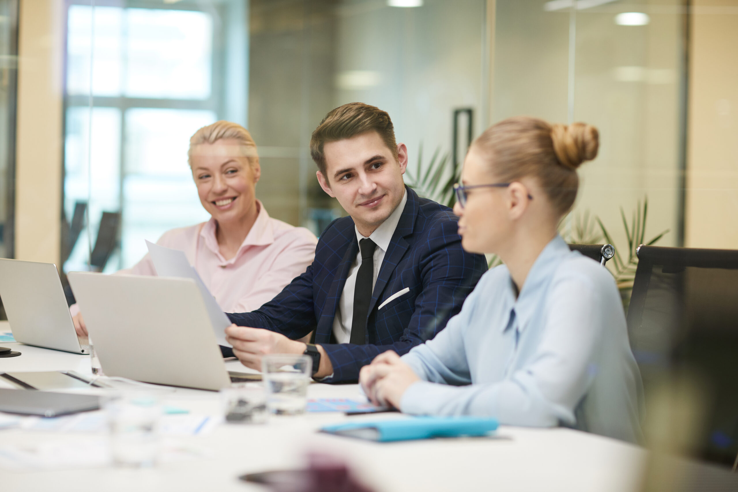 A group of three professionals in a meeting | Jacko Law Group, PC
