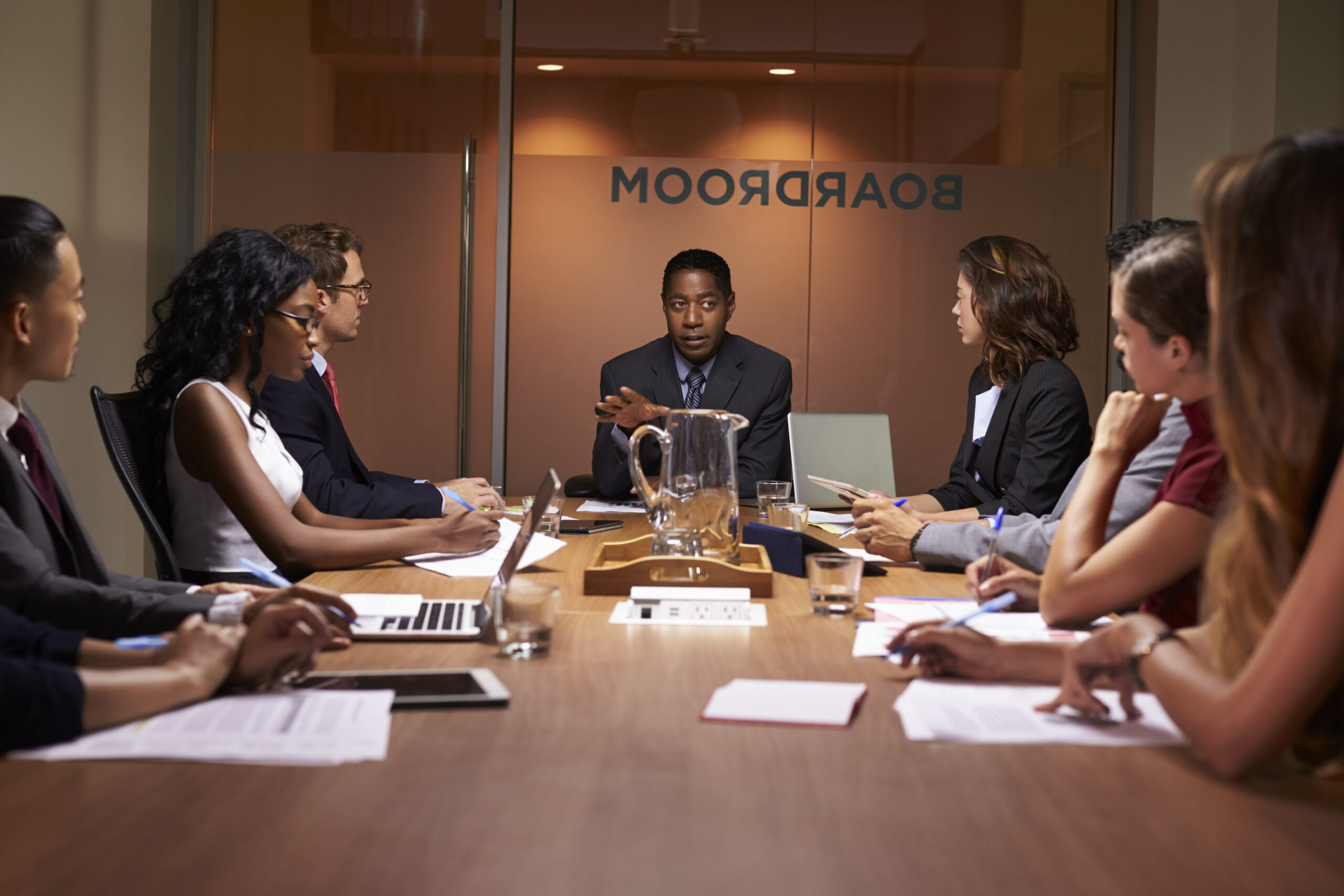 A group of professionals engaged in a discussion | Jacko Law Group, PC