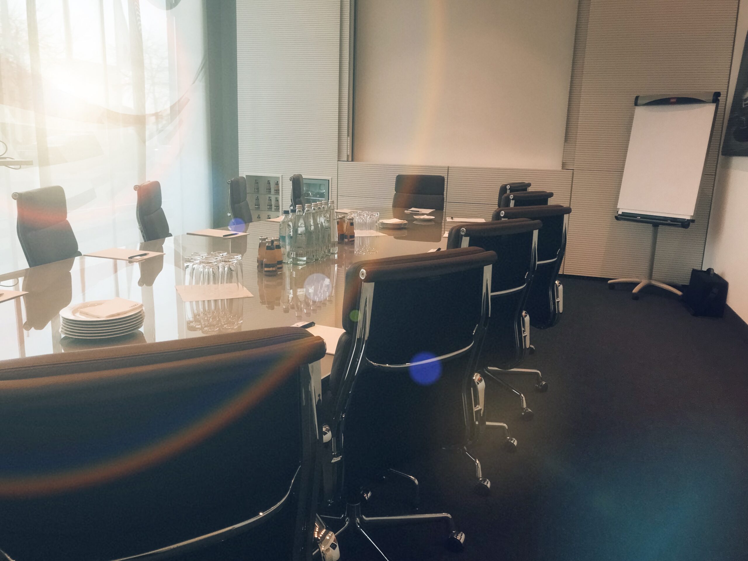 A modern conference room with a large table and chairs| Jacko Law Group, PC