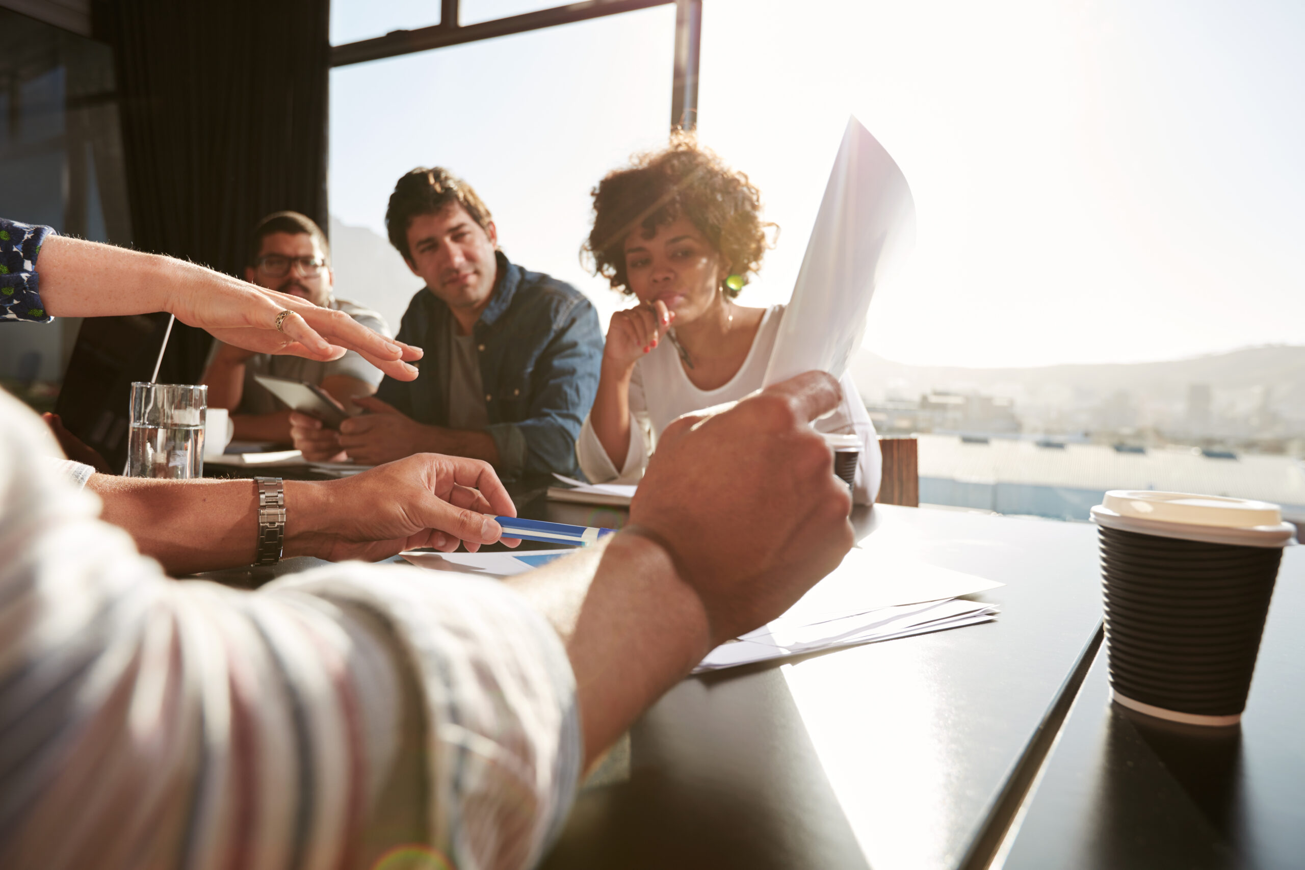 A group of people sitting at a table | Jacko Law Group, PC
